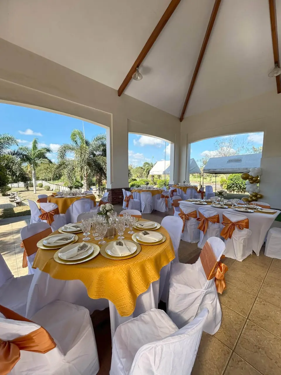 Gold outdoor celebration table setting ready for guests