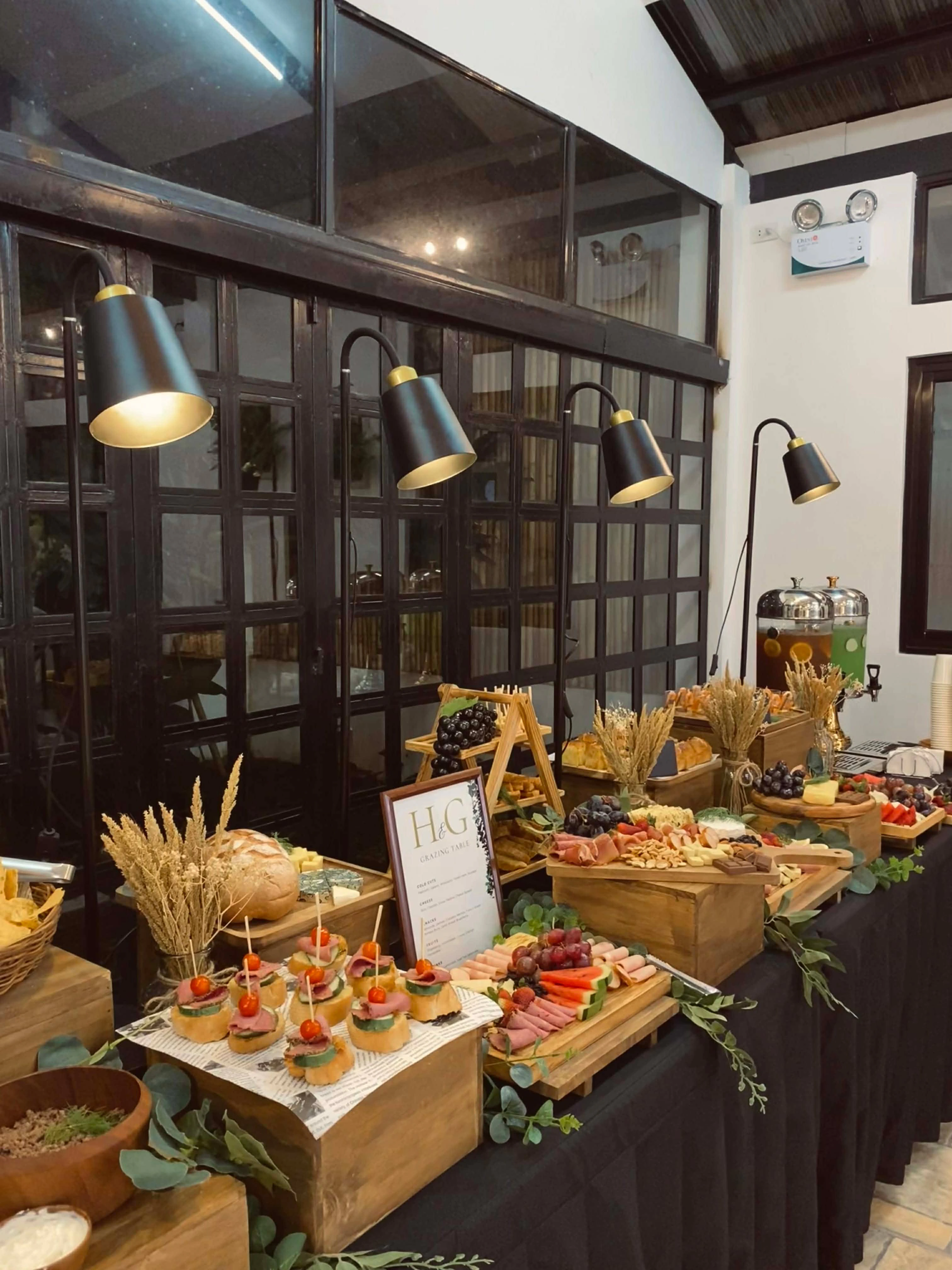 The Feastful Events catering team behind a complete buffet line