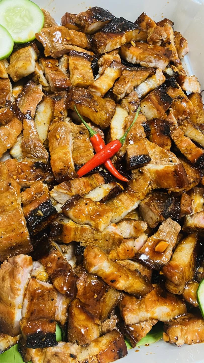 Glazed pork belly arranged in a ready-to-share party tray